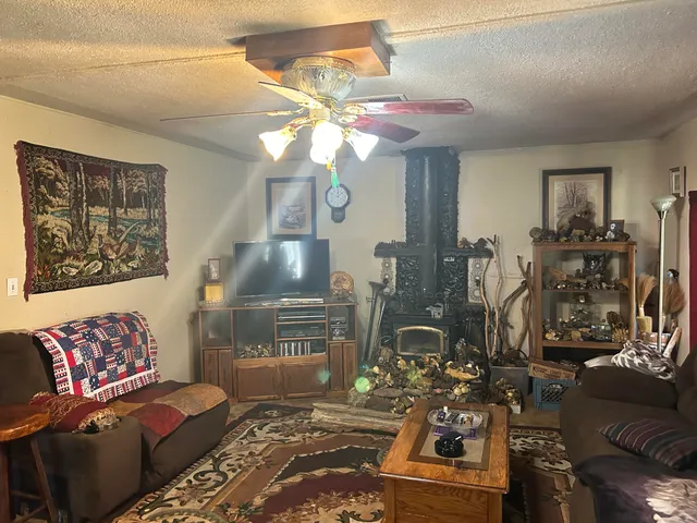a kitchen view of a fireplace and dining table