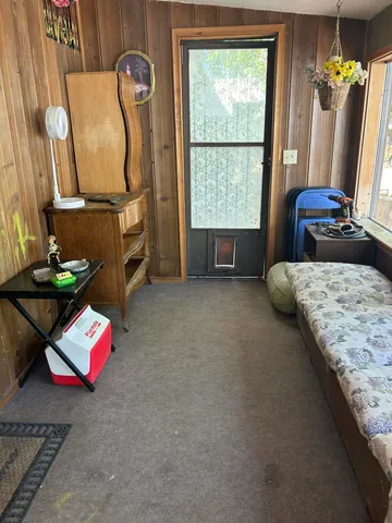 a view of entryway with workspace and stairs