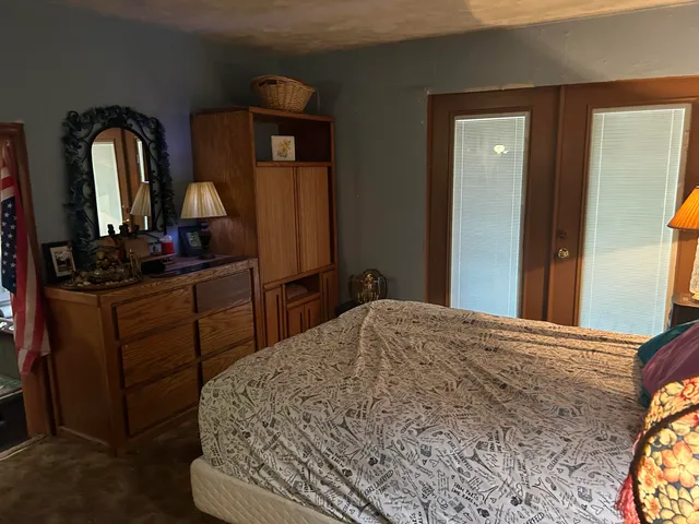 a kitchen with a refrigerator and a stove