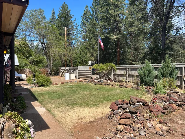a view of outdoor space with wooden deck and seating
