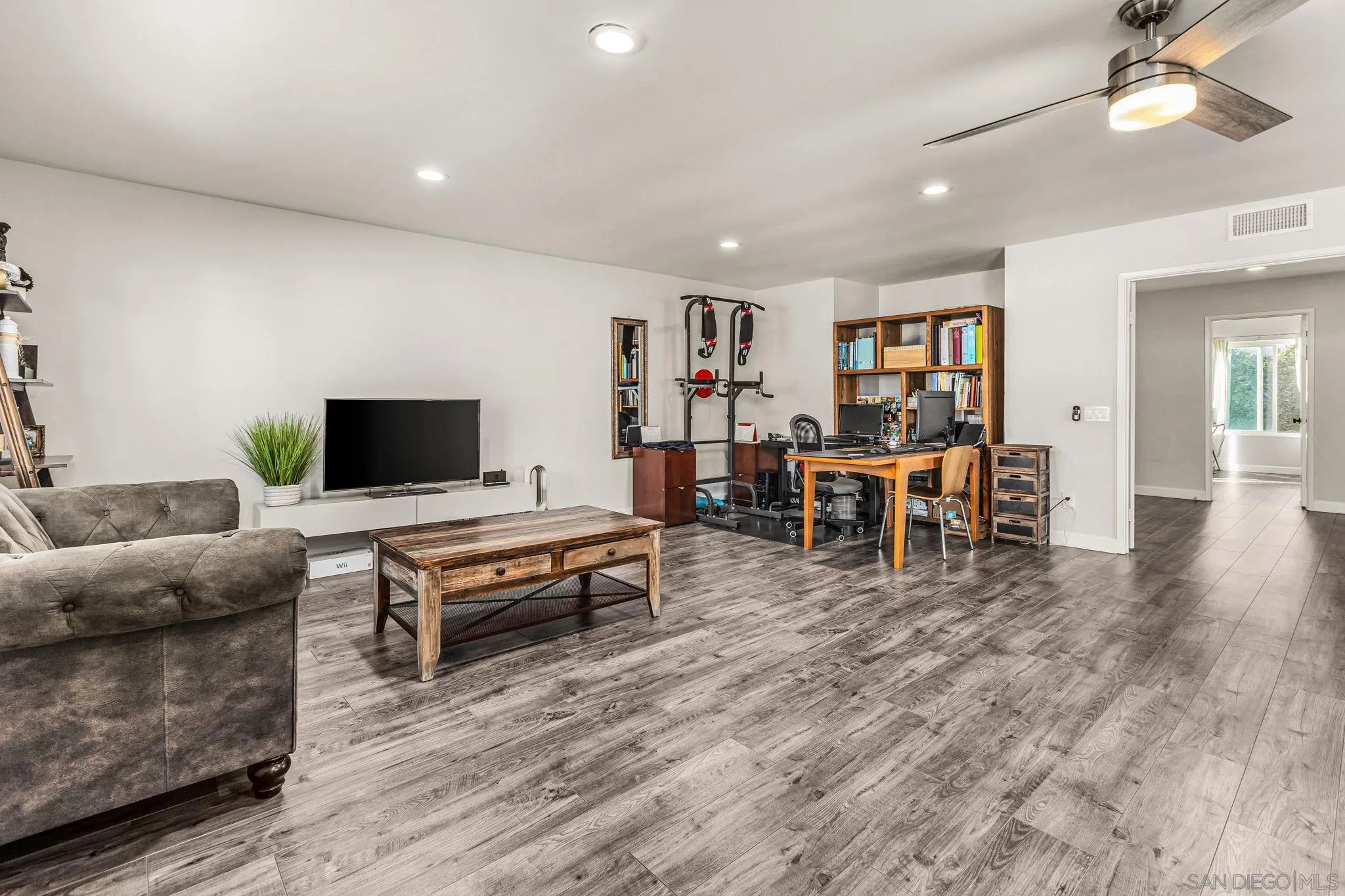 10831 Ironwood Road Scripps Ranch, CA 92131 - Photo 18 of 25 a living room with furniture and a flat screen tv