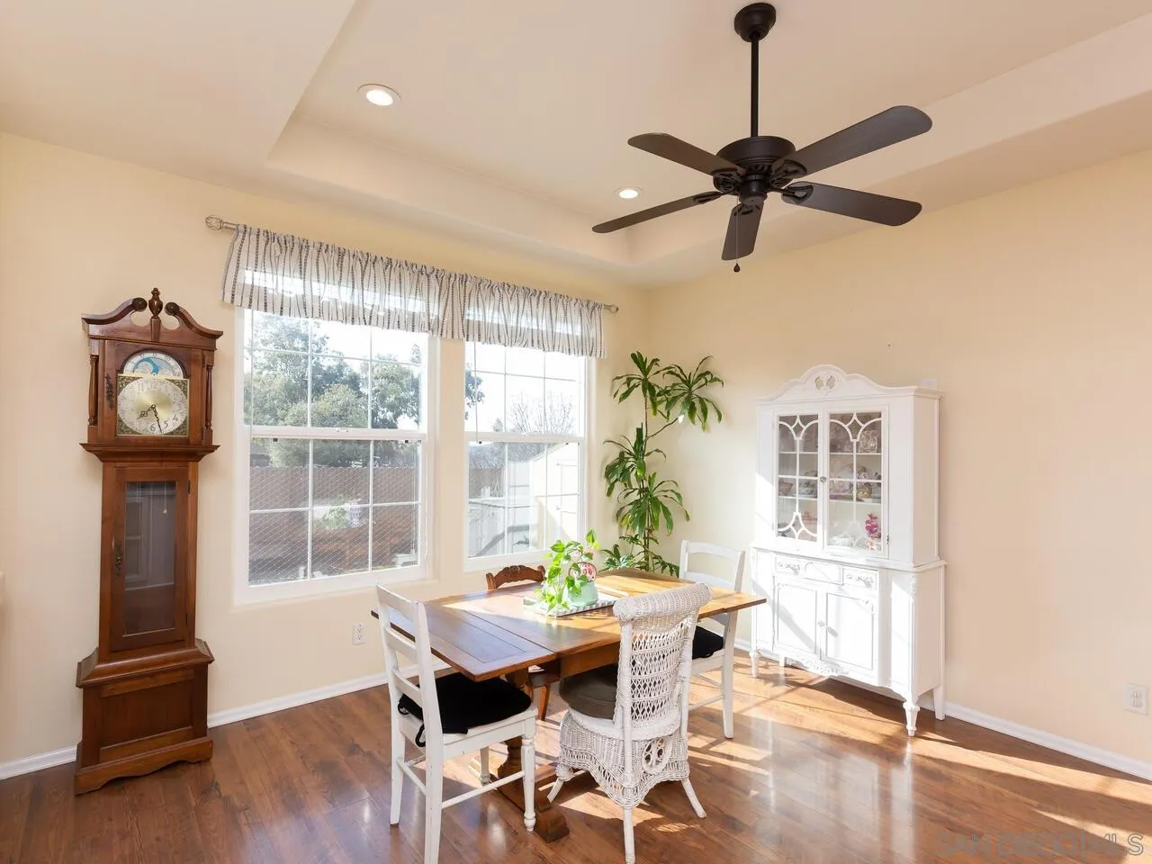 1732 Tavern Road Alpine, CA 91901 - Photo 31 of 60 a dining room with wooden floor a chandelier a wooden table and chairs