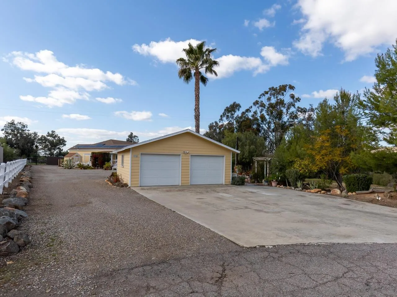 1732 Tavern Road Alpine, CA 91901 - Photo 4 of 60 a front view of a house with a yard and garage