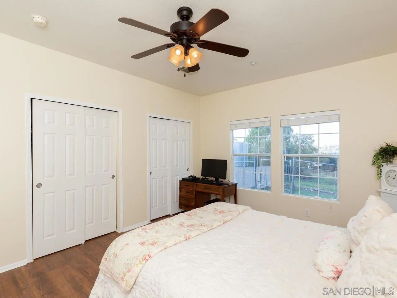 1732 Tavern Road Alpine, CA 91901 - Photo 42 of 60 a bedroom with a bed and a large window with a flat screen tv