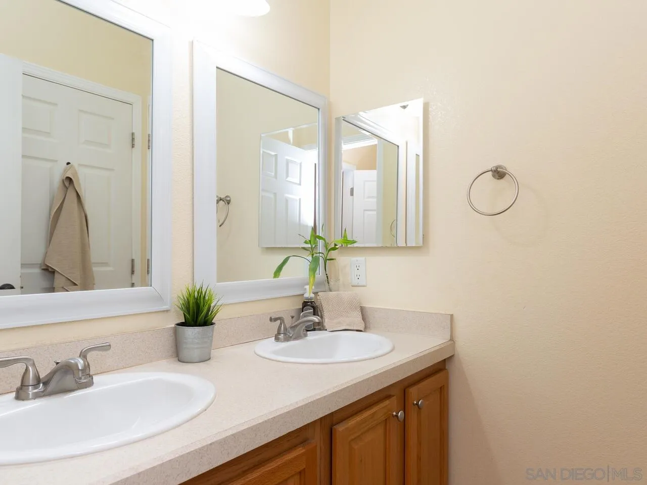 1732 Tavern Road Alpine, CA 91901 - Photo 43 of 60 a bathroom with a granite countertop sink and a mirror