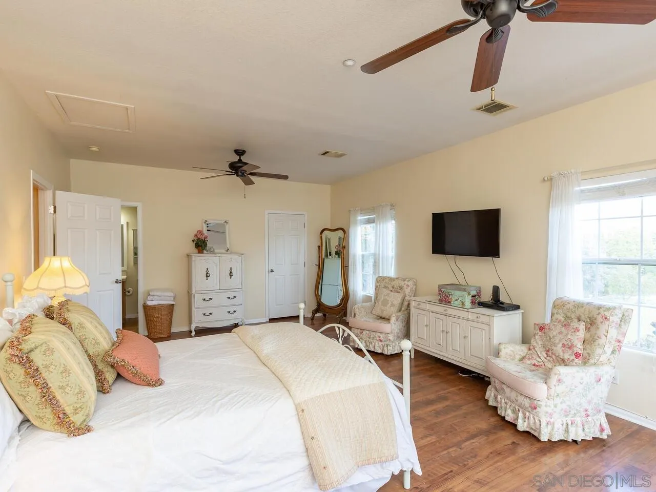 1732 Tavern Road Alpine, CA 91901 - Photo 46 of 60 a bedroom with a bed and wooden floor