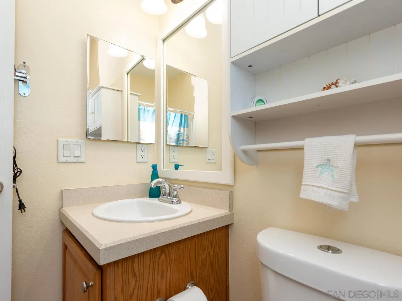 1732 Tavern Road Alpine, CA 91901 - Photo 47 of 60 a bathroom with a sink toilet and mirror