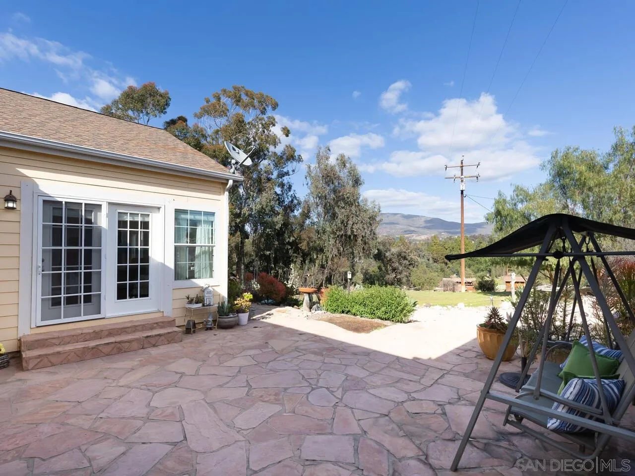 1732 Tavern Road Alpine, CA 91901 - Photo 51 of 60 a view of a house with backyard sitting area and garden