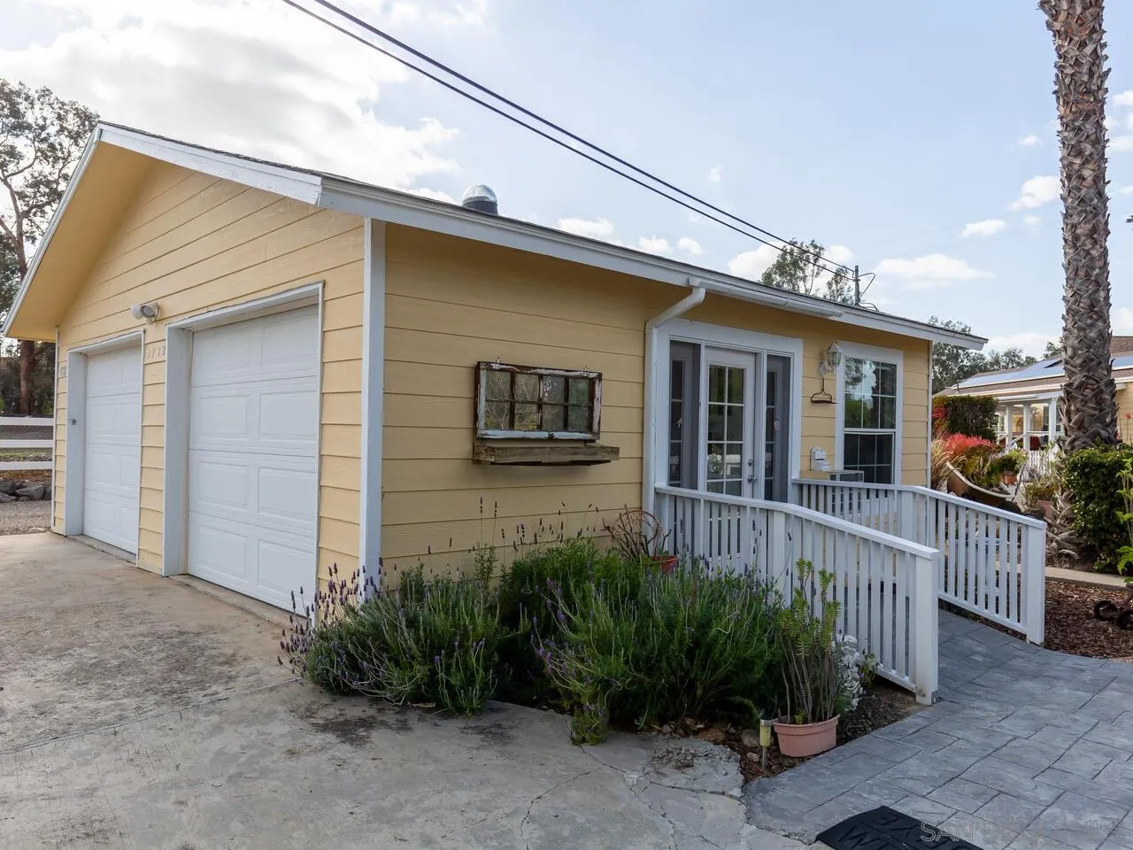 1732 Tavern Road Alpine, CA 91901 - Photo 6 of 60 a view of a house with a small yard and plants