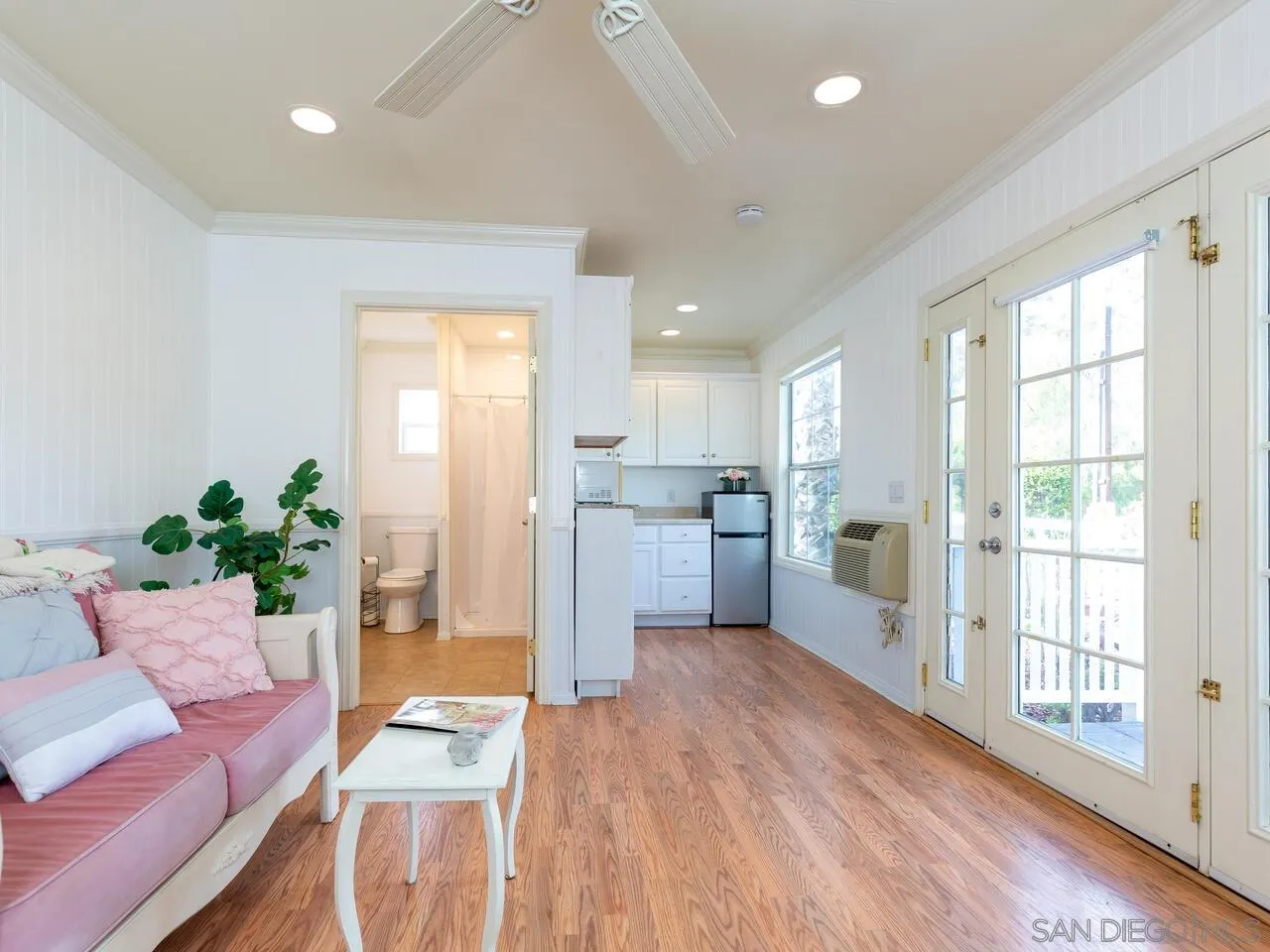 1732 Tavern Road Alpine, CA 91901 - Photo 8 of 60 a living room with stainless steel appliances kitchen island granite countertop a refrigerator a oven a sink with wooden cabinets and wooden floor