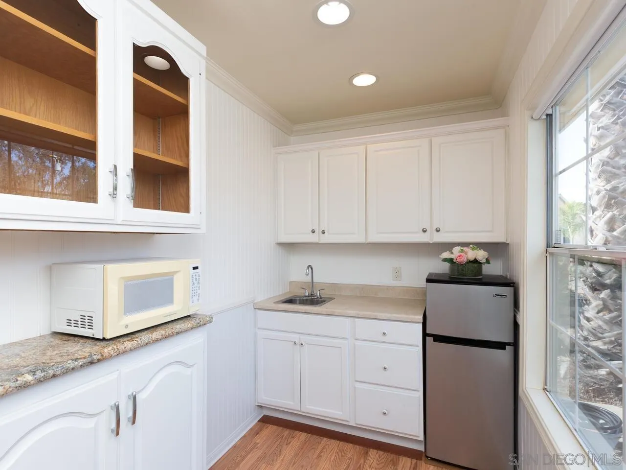 1732 Tavern Road Alpine, CA 91901 - Photo 10 of 60 a kitchen with granite countertop white cabinets and white appliances