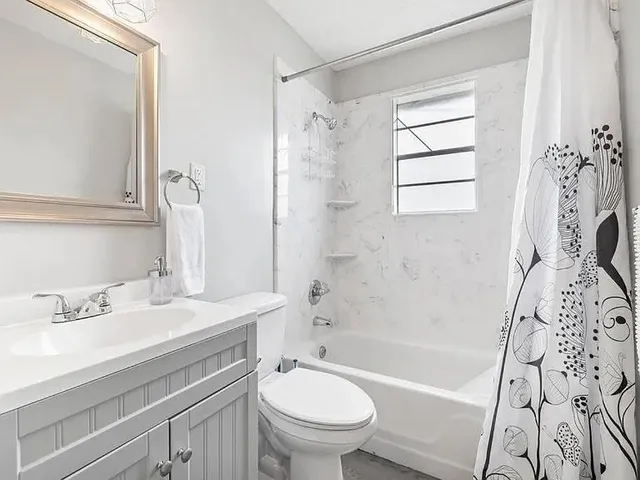 a bathroom with a sink a toilet and a bathtub