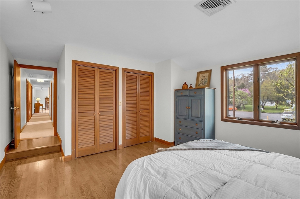 7 Donna Road Andover, MA 01810 - Photo 15 of 42 a bedroom with a bed and wooden floor