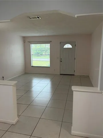 a view of a utility room and empty room