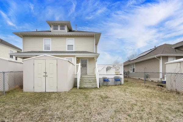 a view of a back yard of the house