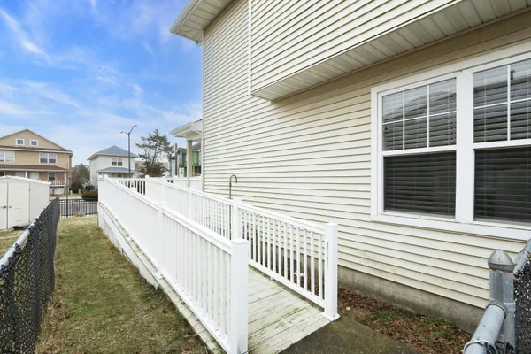a view of a balcony with two windows