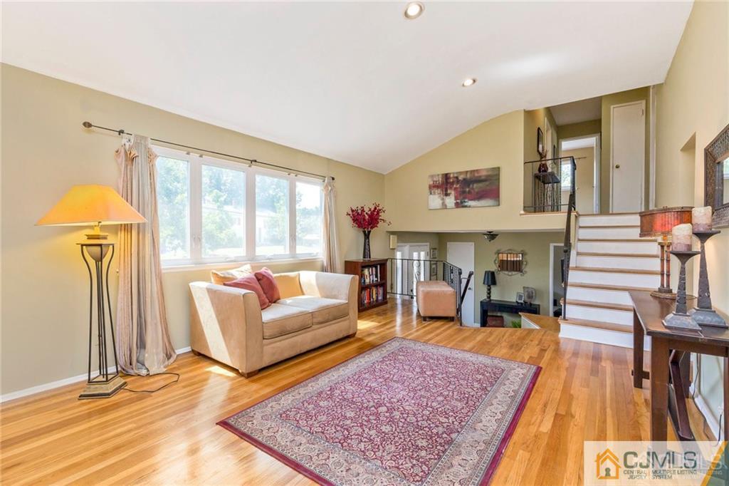 28 Appleman Road Somerset, NJ 08873 - Photo 11 of 25 a living room with furniture and a rug