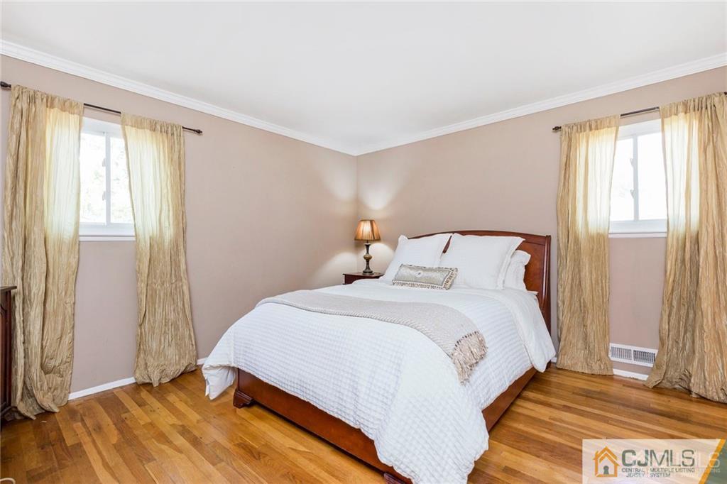 28 Appleman Road Somerset, NJ 08873 - Photo 18 of 25 a bedroom with a bed and a window