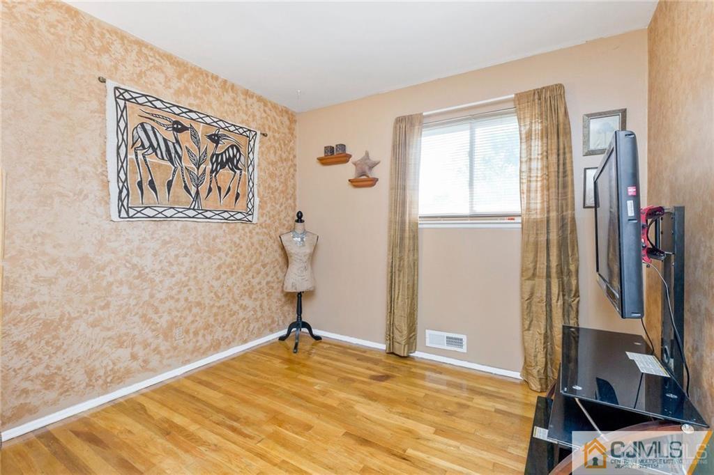 28 Appleman Road Somerset, NJ 08873 - Photo 21 of 25 a view of a bedroom with wooden floor and bathroom