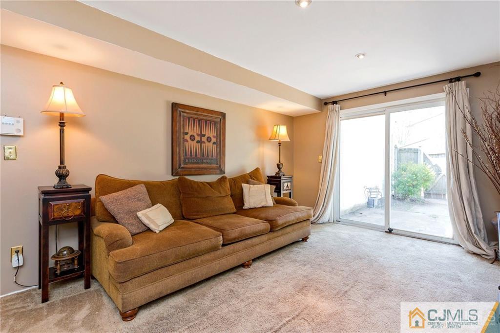 28 Appleman Road Somerset, NJ 08873 - Photo 4 of 25 a living room with furniture and a window