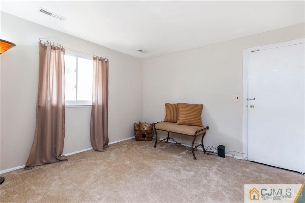 28 Appleman Road Somerset, NJ 08873 - Photo 6 of 25 a view of a room with furniture and a window