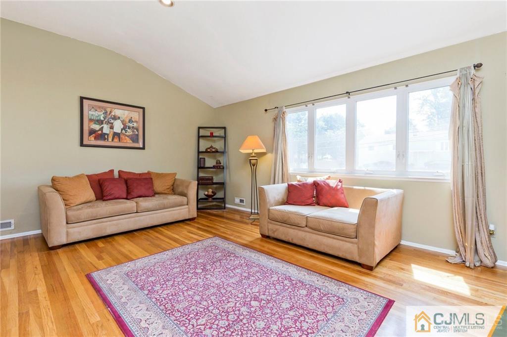 28 Appleman Road Somerset, NJ 08873 - Photo 9 of 25 a living room with furniture and a rug