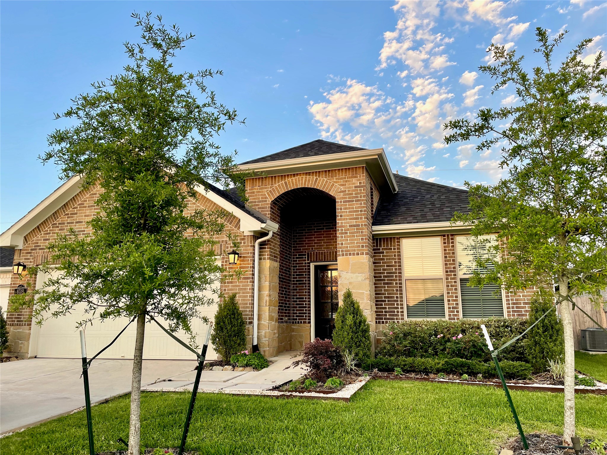 8319 Divot Trace Fulshear, TX 77441 - Photo 2 of 37 Elegant brick & stone arch to welcome you home.