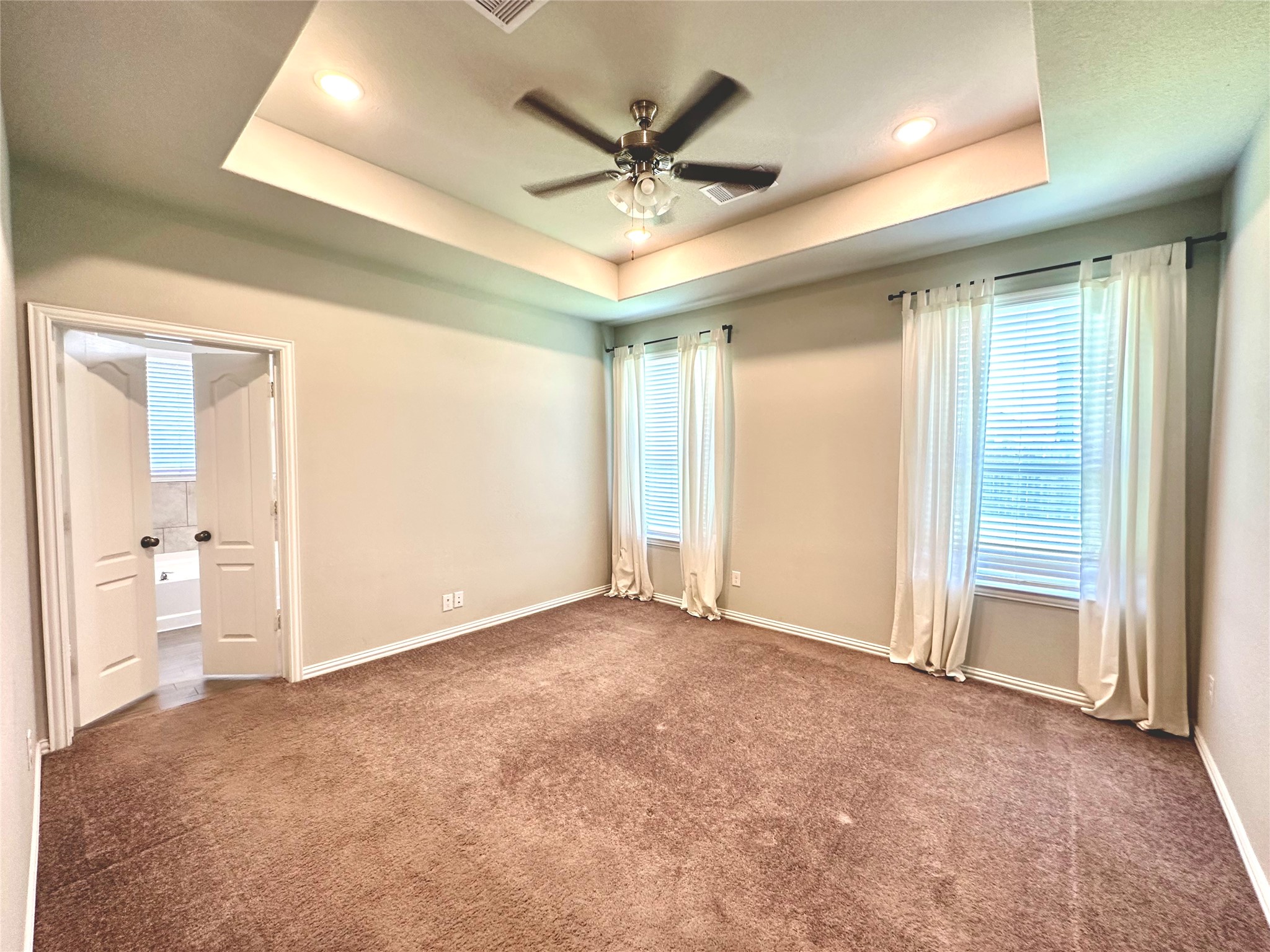 8319 Divot Trace Fulshear, TX 77441 - Photo 22 of 37 Tray ceilings and ceiling fan