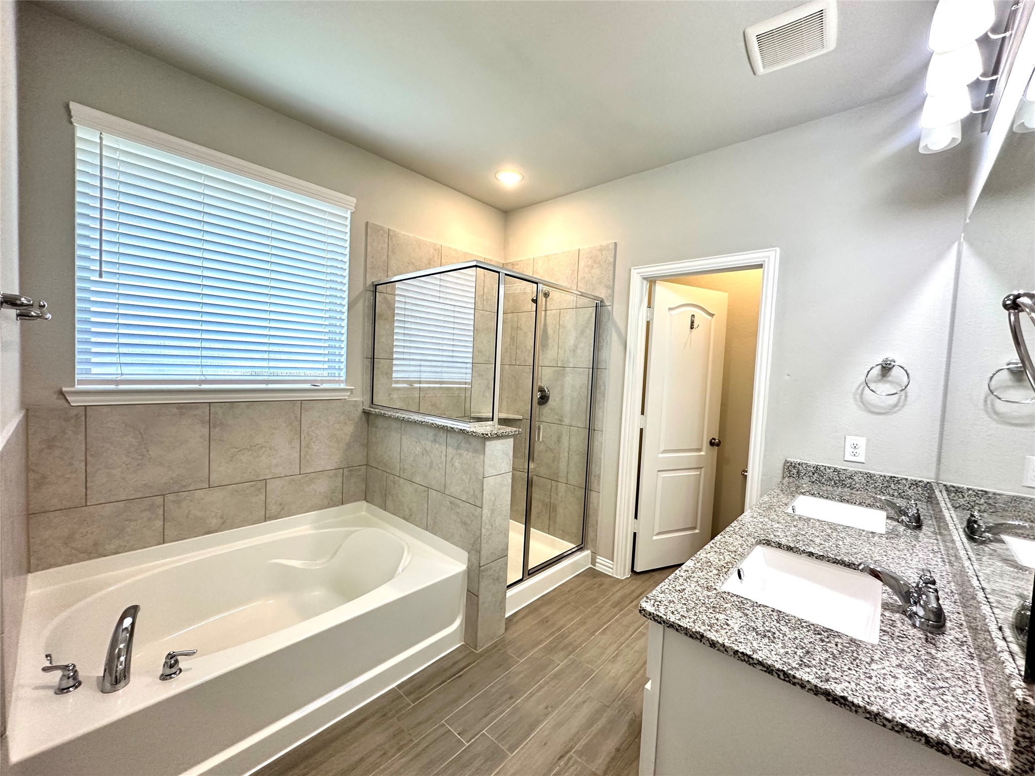 8319 Divot Trace Fulshear, TX 77441 - Photo 23 of 37 Primary bathroom with relaxing bathtub and private toilet