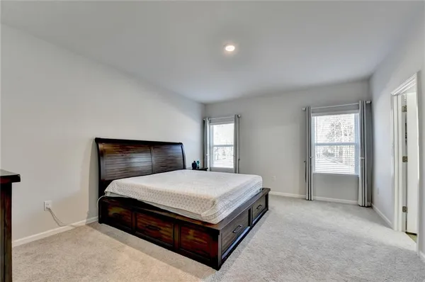 a room with a bed and window