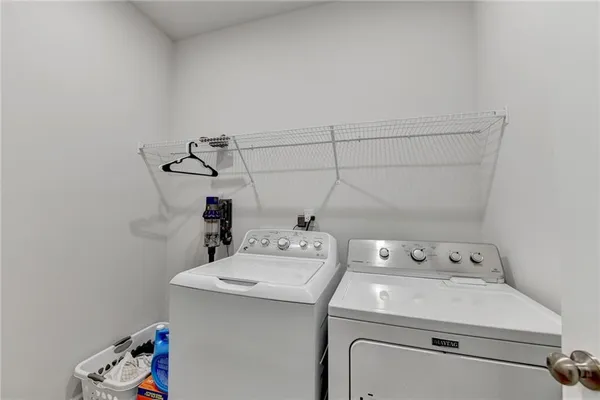 a view of outdoor space with swimming pool and trees in the background