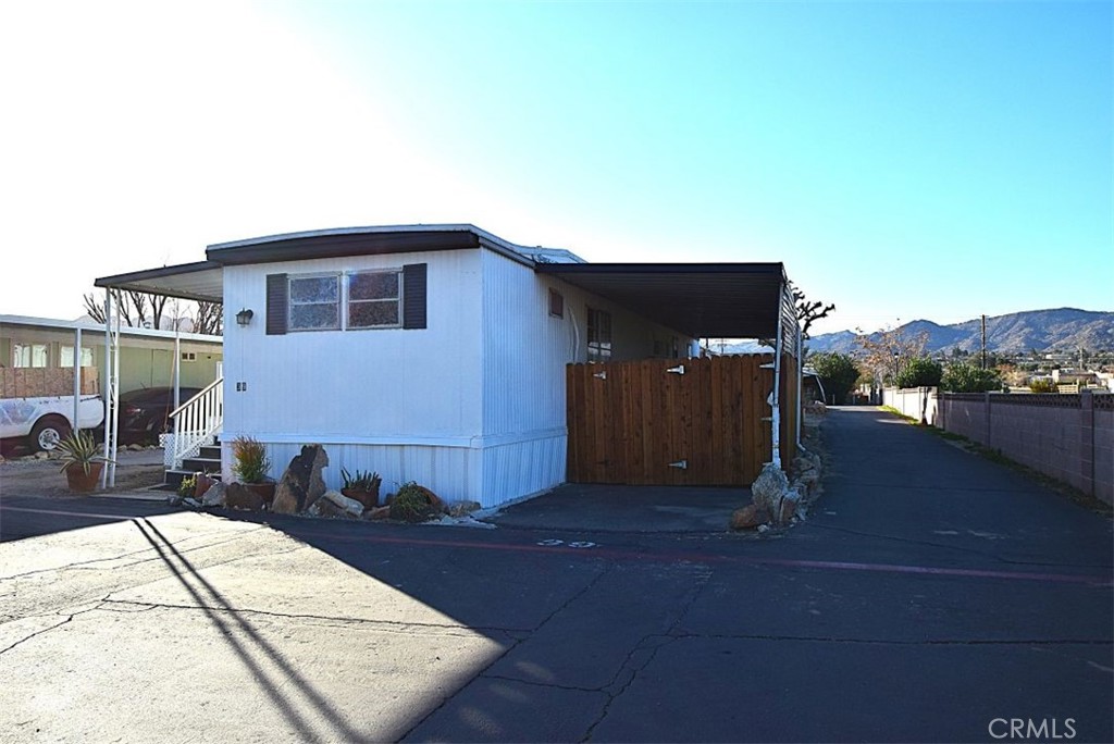 6426 Valley View Street, Unit 39 Joshua Tree, CA 92252 - Photo 3 of 11 a view of a house with backyard