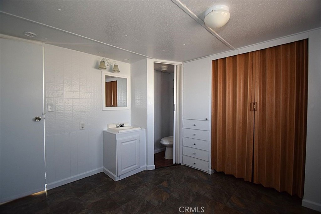 6426 Valley View Street, Unit 39 Joshua Tree, CA 92252 - Photo 10 of 11 a view of an empty room with closet area