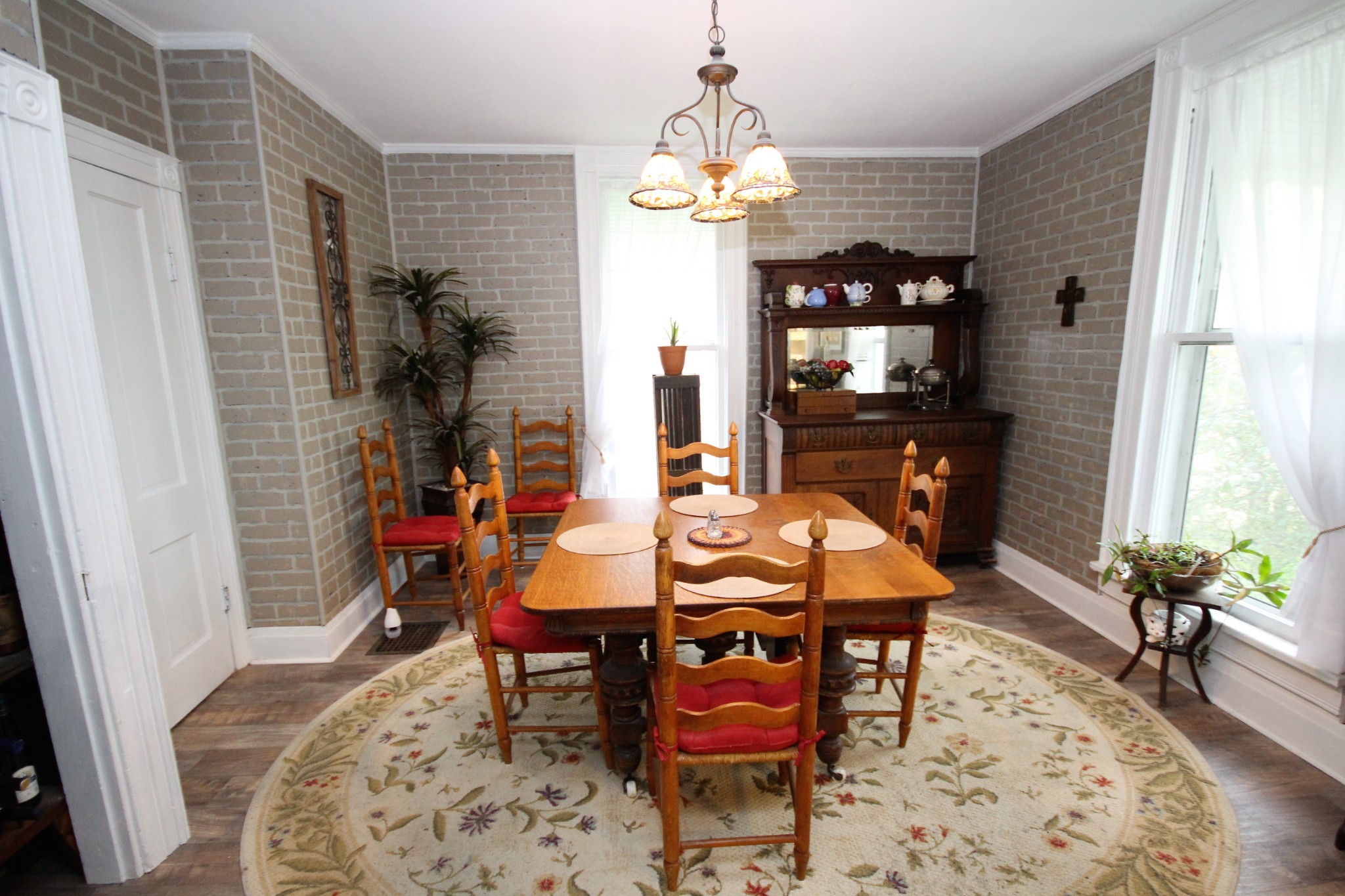 312 North Main Street Springfield, TN 37172 - Photo 32 of 47 a dining room with chandelier and wooden floor