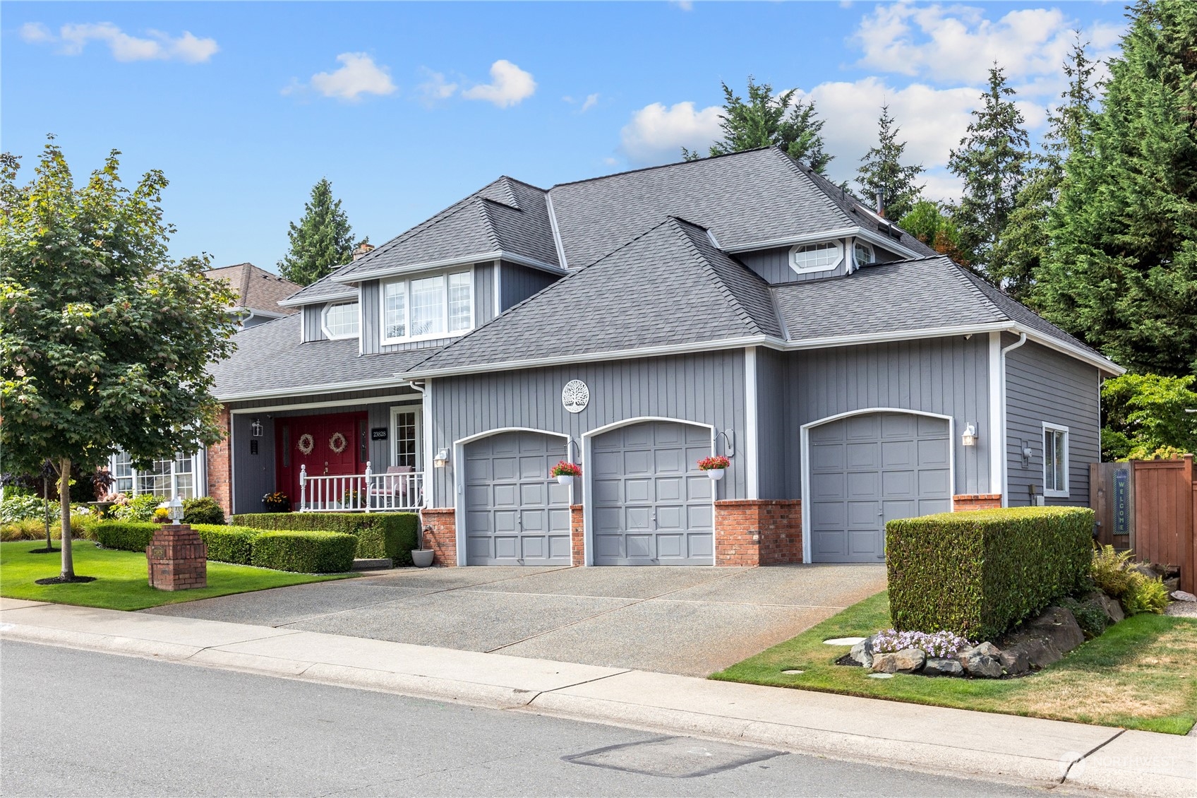 23828 22nd Drive Southeast Bothell, WA 98021 - Photo 1 of 33 a front view of a house with a yard and garage