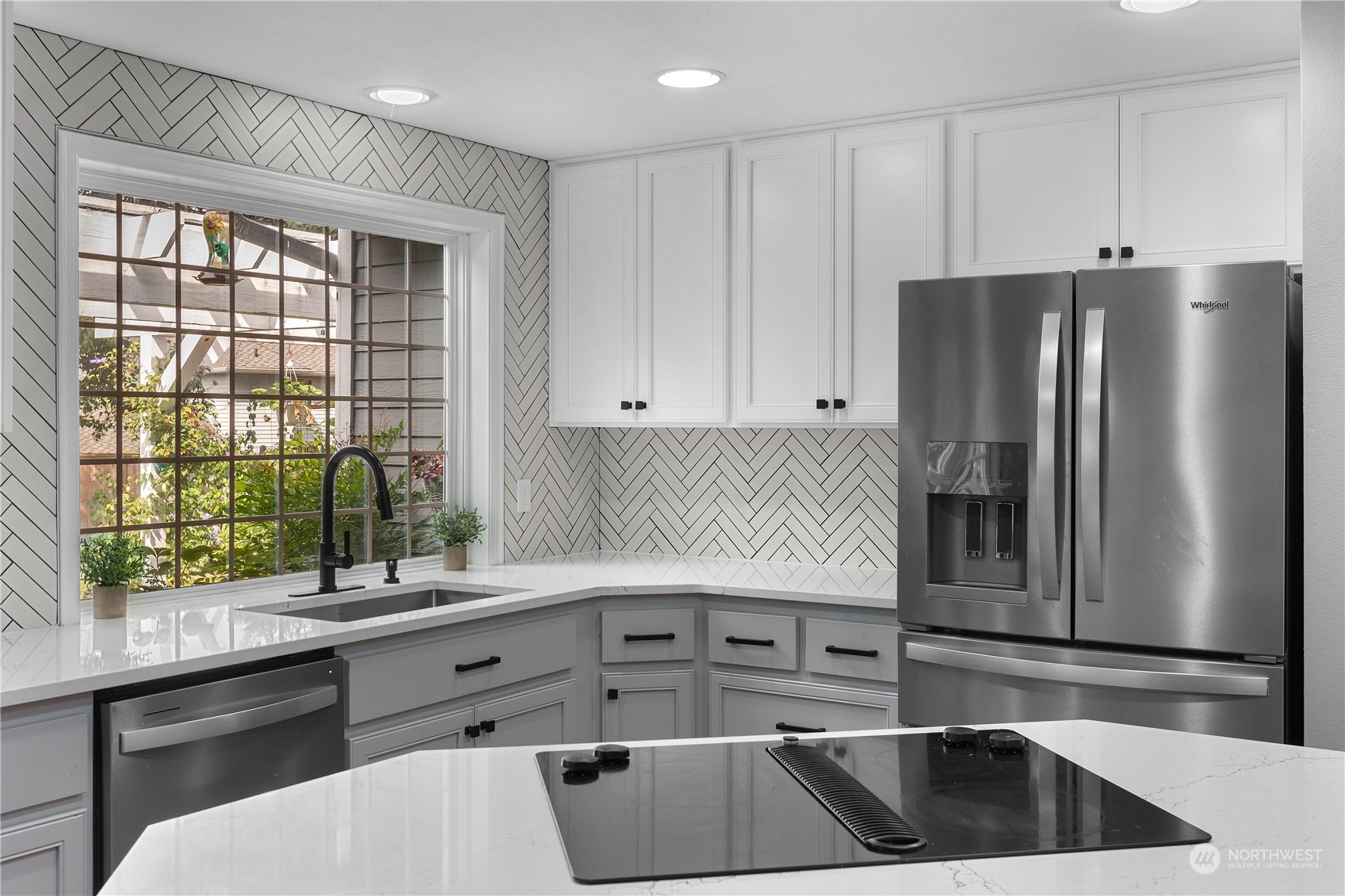 23828 22nd Drive Southeast Bothell, WA 98021 - Photo 13 of 33 a kitchen with a refrigerator and a sink
