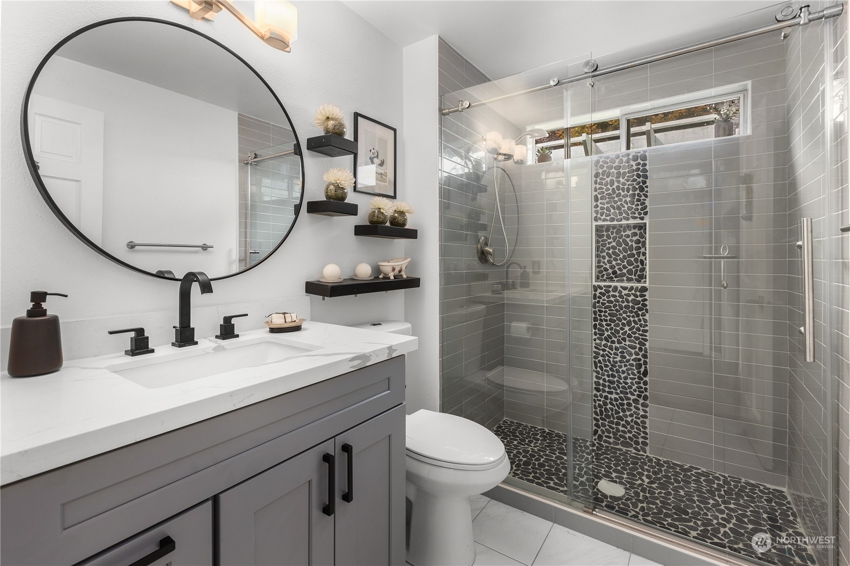 23828 22nd Drive Southeast Bothell, WA 98021 - Photo 16 of 33 a bathroom with a sink a toilet and a mirror
