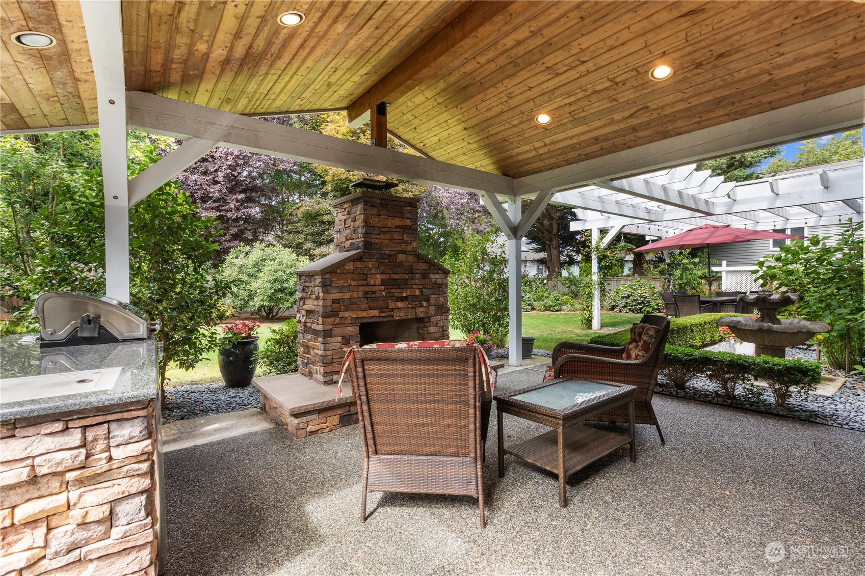 23828 22nd Drive Southeast Bothell, WA 98021 - Photo 27 of 33 a patio with patio a table and chairs and potted plants