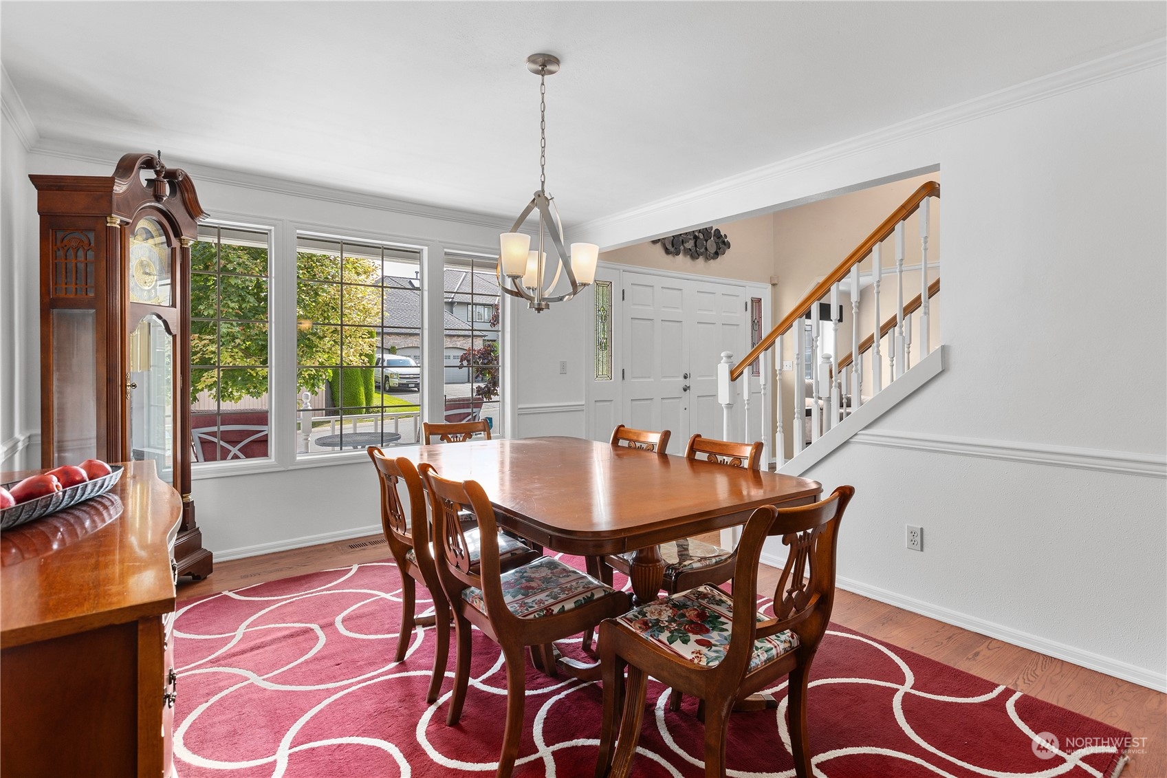 23828 22nd Drive Southeast Bothell, WA 98021 - Photo 5 of 33 a dining room with furniture a chandelier and wooden floor