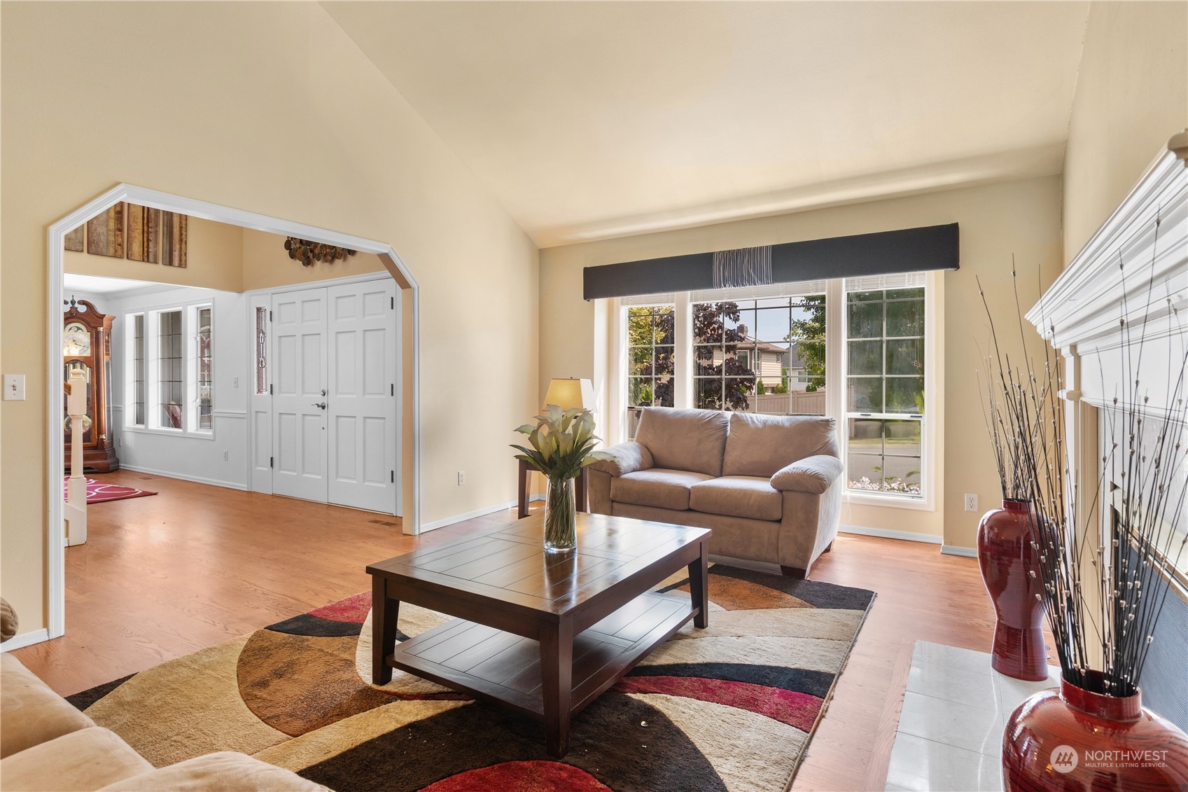 23828 22nd Drive Southeast Bothell, WA 98021 - Photo 7 of 33 a living room with furniture a window and a fireplace