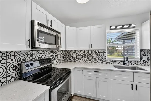 a bedroom with a bed and a potted plant