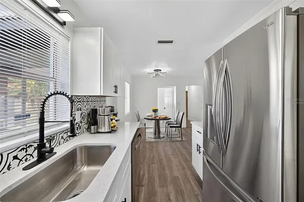 a view of a dining room with furniture window and outside view