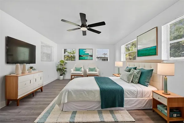 an aerial view of a house with a yard basket ball court and outdoor seating