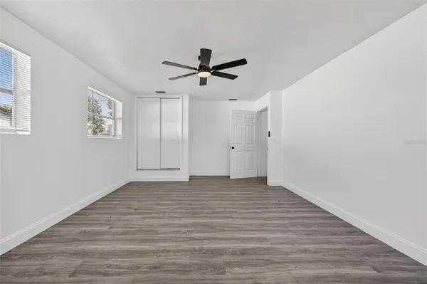 an aerial view of a house with a yard basket ball court