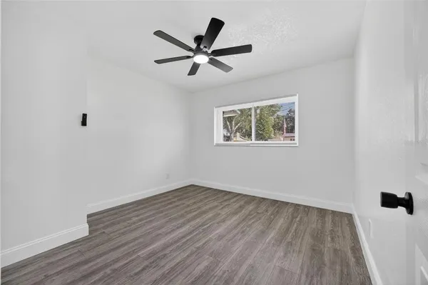 an aerial view of residential houses with outdoor space and swimming pool