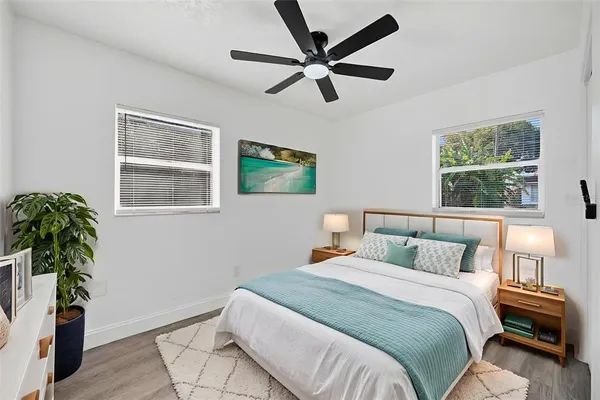 an aerial view of residential houses with city view