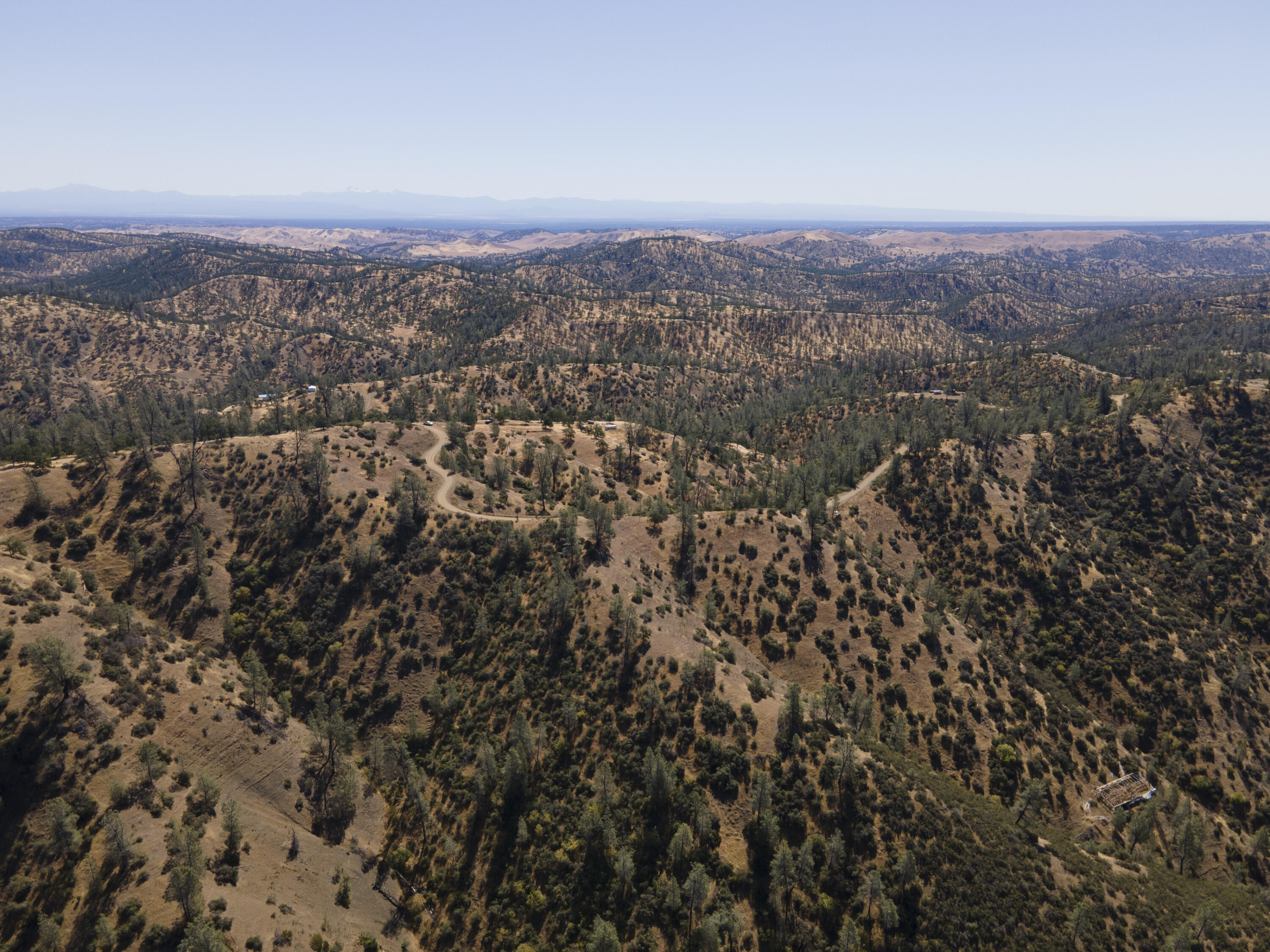 4100 Yolla Bolly Road Igo, CA 96047 - Photo 12 of 24 an aerial view of house with yard and mountain view in back