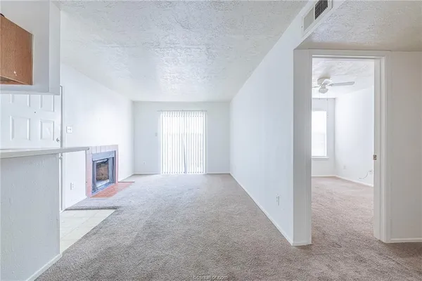a view of livingroom with furniture and fireplace