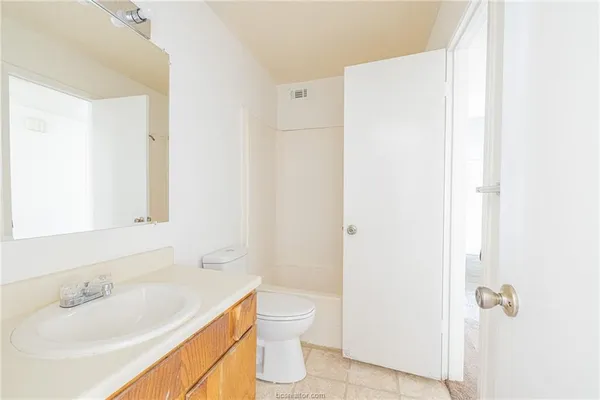 a view of entryway with wooden floor and stairs