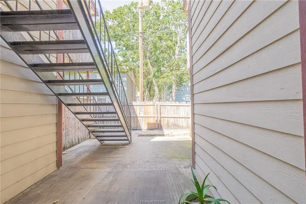a view of empty room with a fireplace
